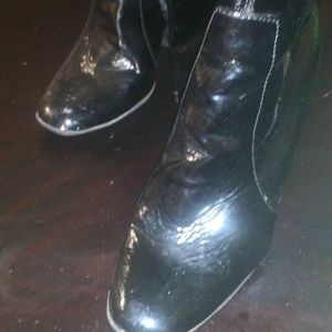 Black shiny high top high heel boots